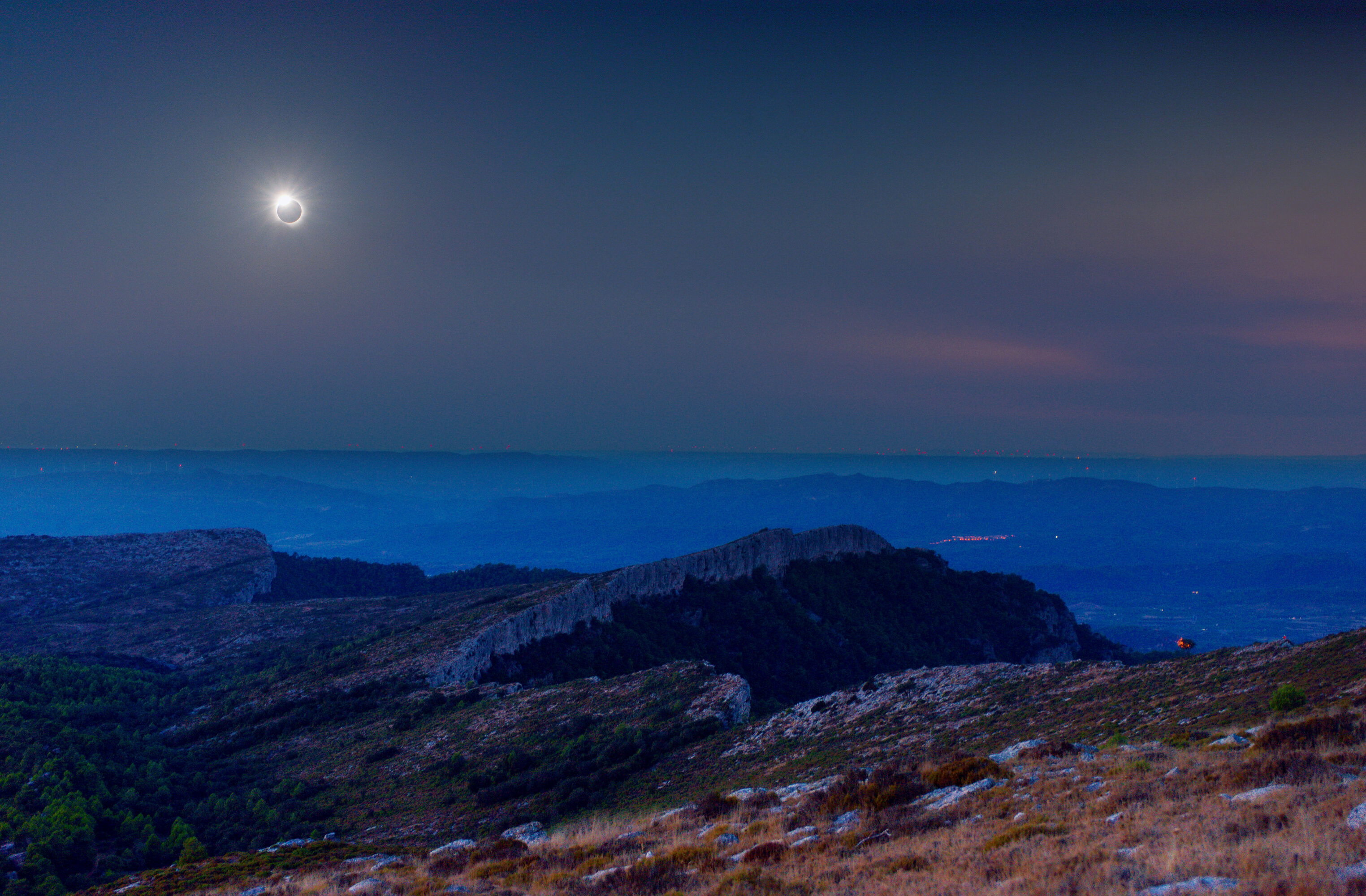 the totality over the mountains